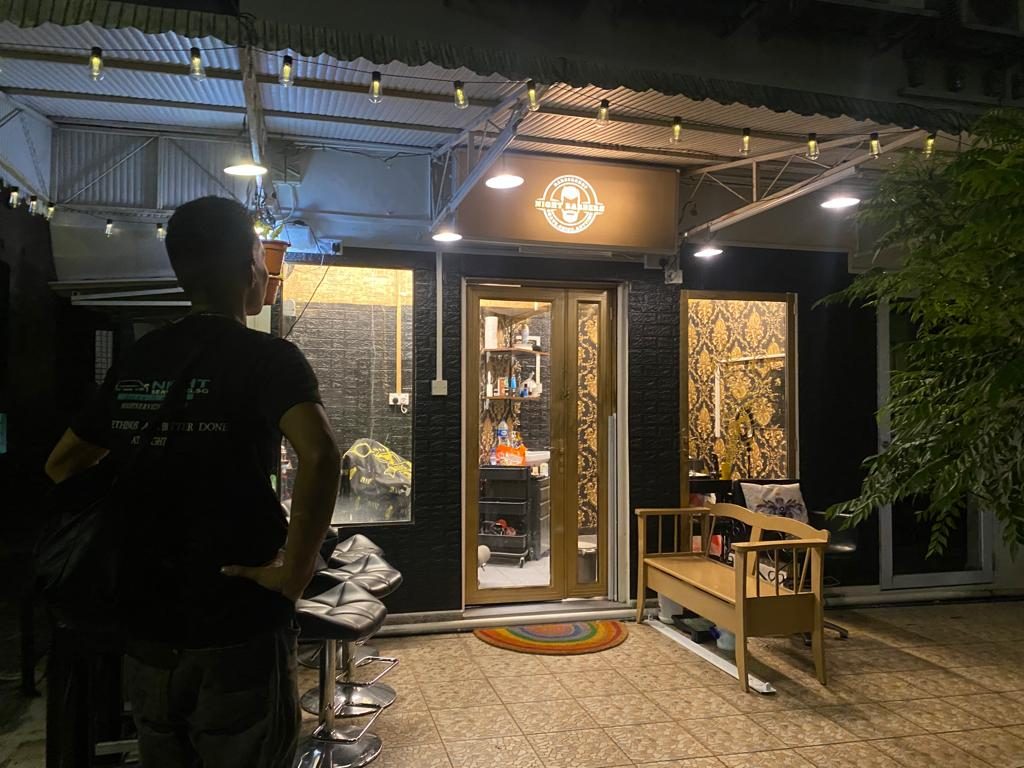 The shopfront at night with warm lighting